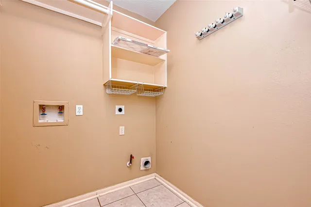 a bathroom with a shower and a window