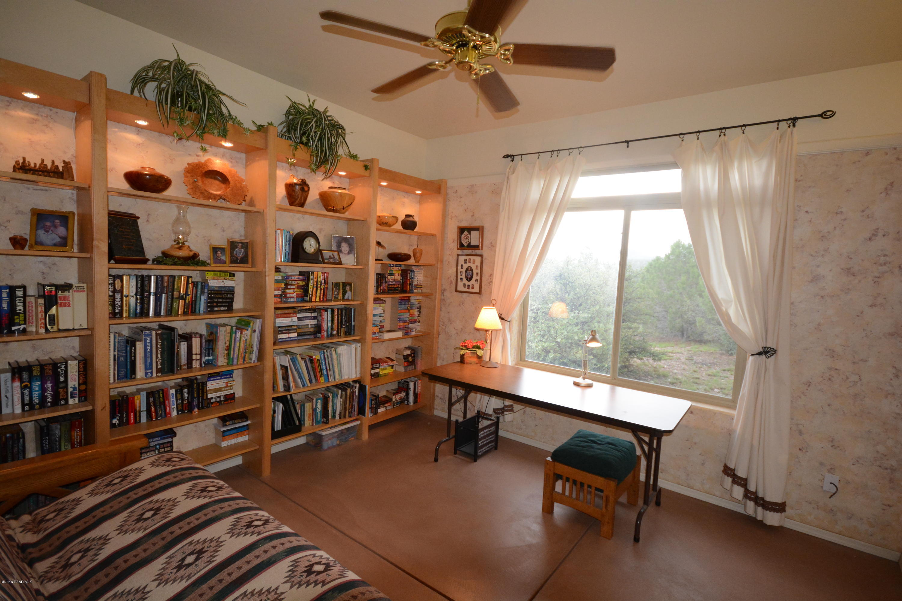 7200 Dillon Wash Road Prescott, AZ 86305 - Photo 29 of 47 a view of a livingroom with furniture and a bookshelf