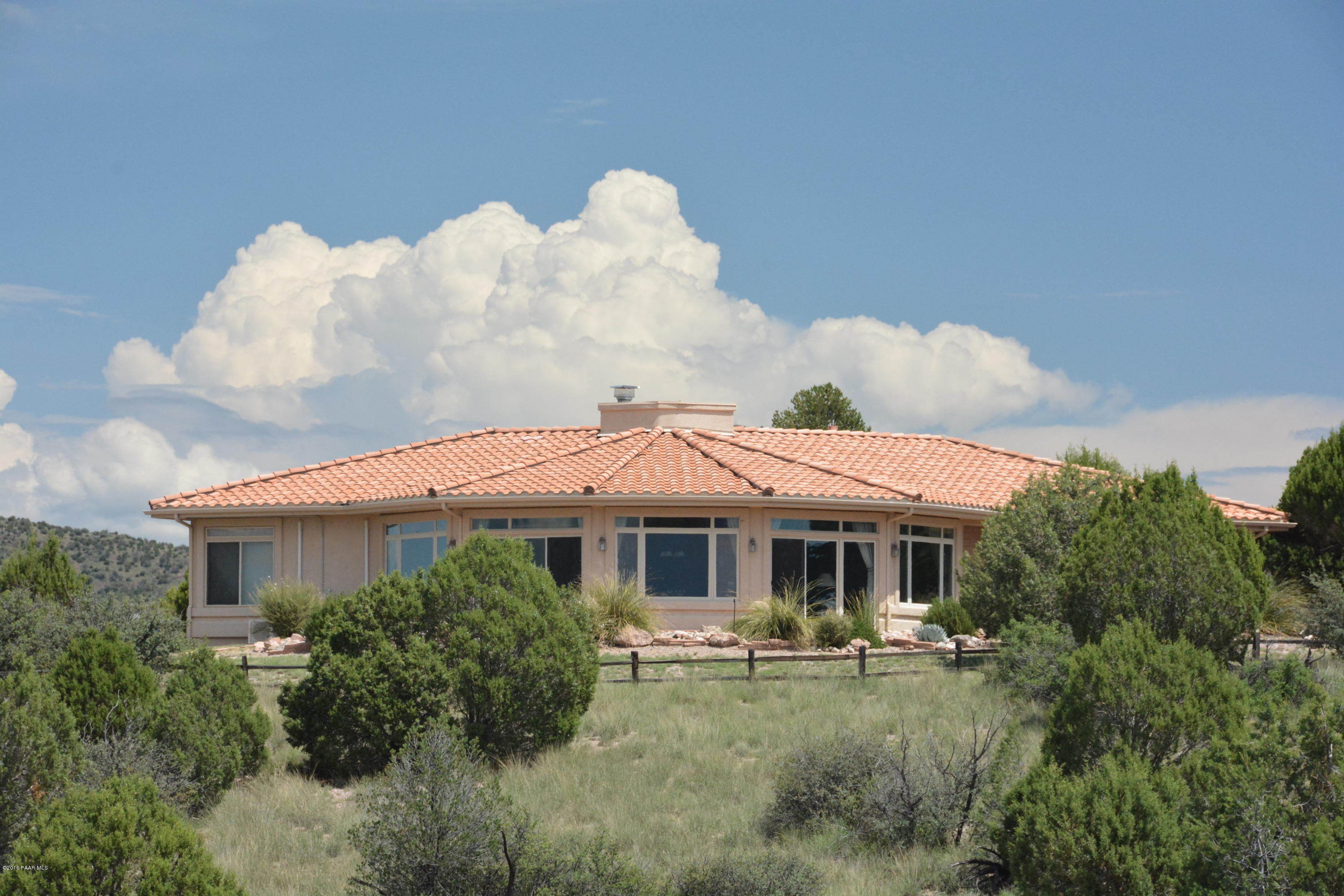 7200 Dillon Wash Road Prescott, AZ 86305 - Photo 4 of 47 a front view of house with yard and trees in the background