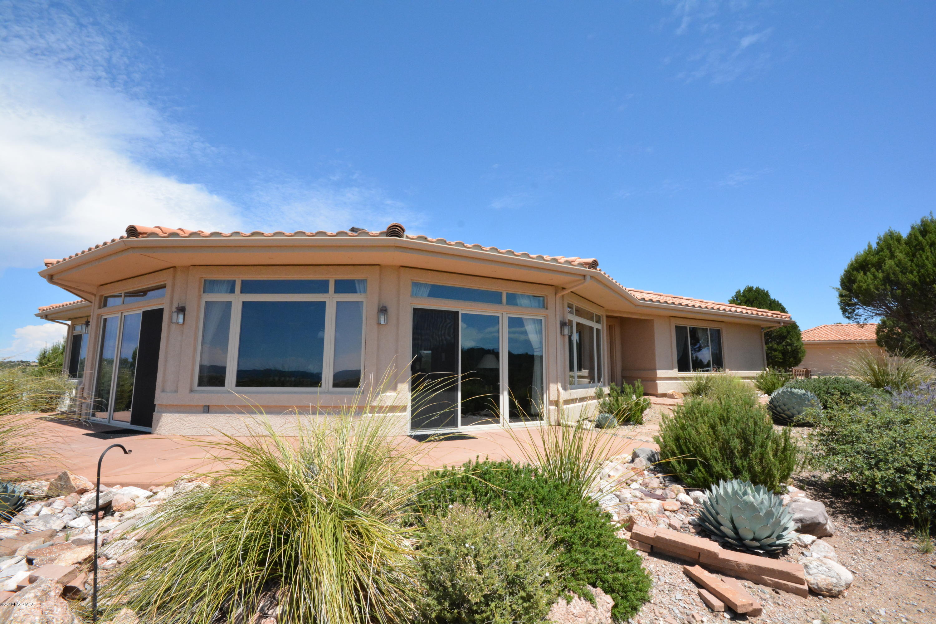 7200 Dillon Wash Road Prescott, AZ 86305 - Photo 5 of 47 a view of a house with a large window and plants