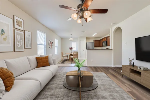 a living room with furniture and a flat screen tv