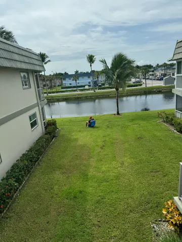a view of a lake with a houses in the back