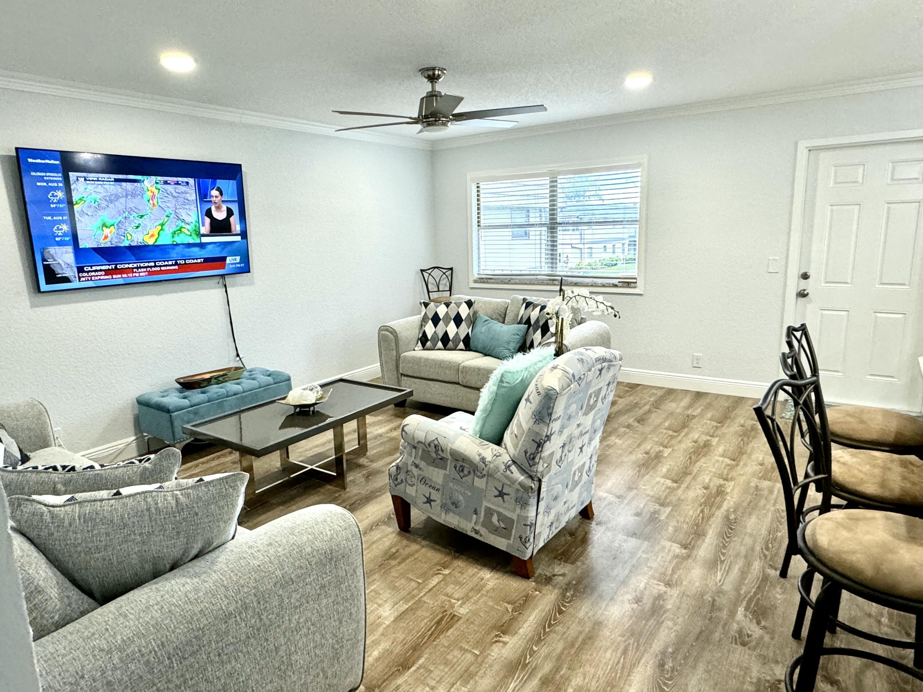 177 Brittany Terrace Delray Beach, FL 33446 - Photo 5 of 24 a living room with furniture and a window