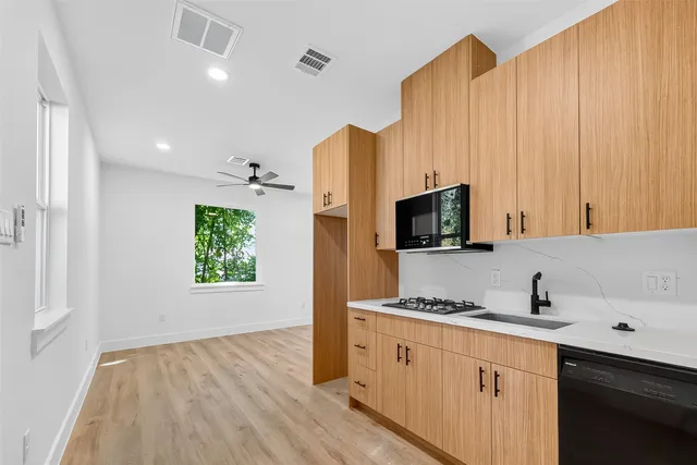 a kitchen with a sink and a window