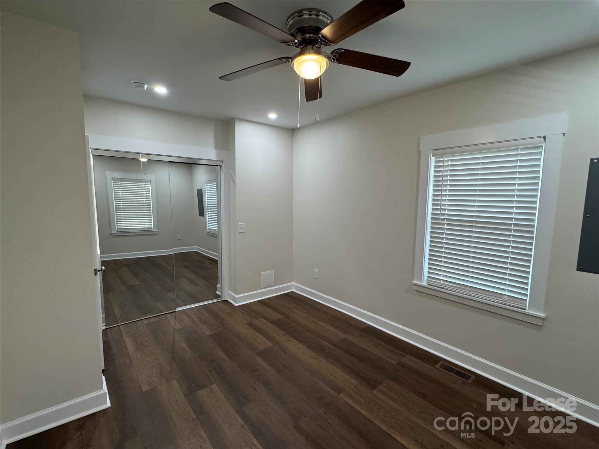 632 Graham Street Albemarle, NC 28001 - Photo 12 of 18 wooden floor in an empty room with a window