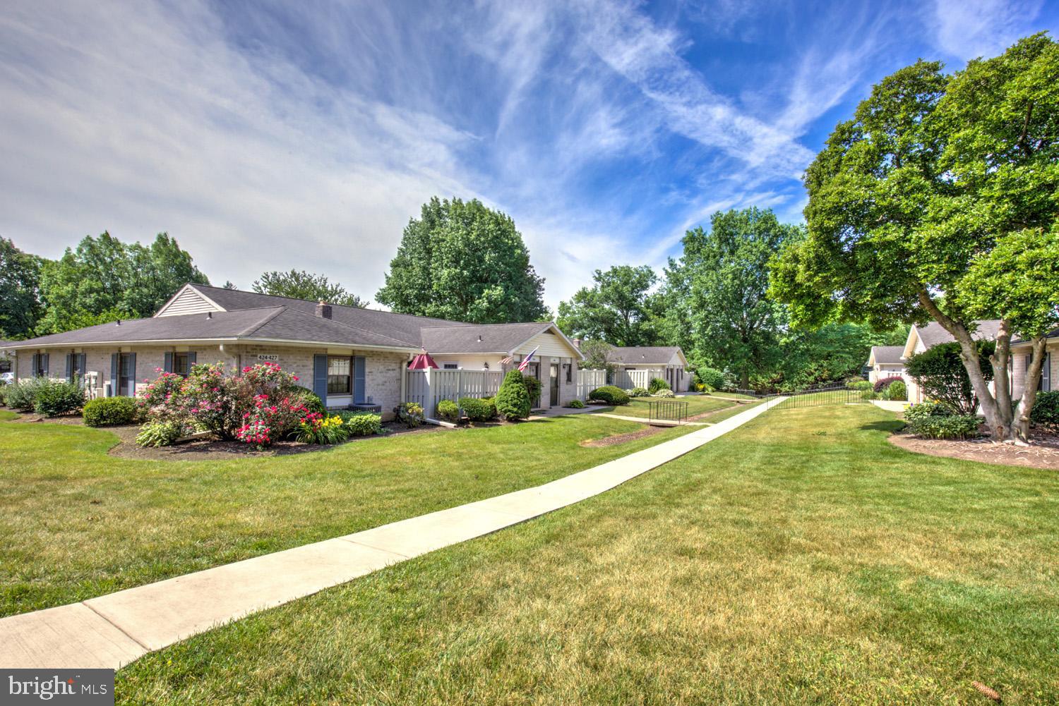425 Valleybrook Drive Lancaster, PA 17601 - Photo 19 of 50 a view of a house with a big yard potted plants and a large tree