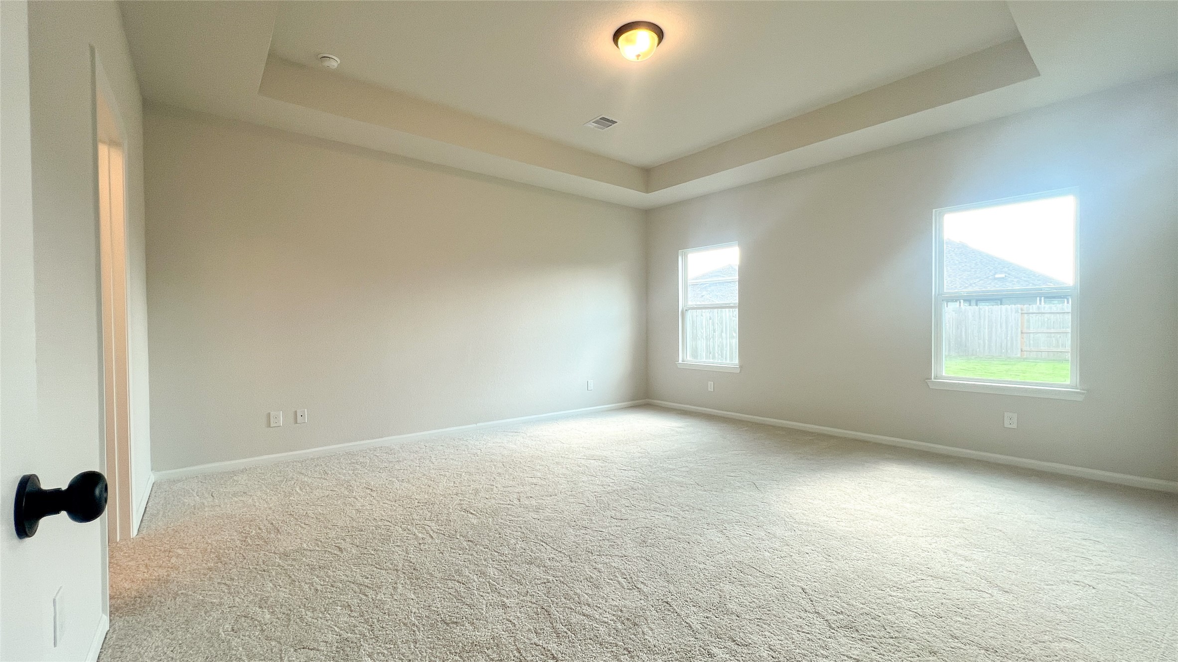 8126 Red Shiner Way Fulshear, TX 77441 - Photo 7 of 20 an empty room with windows and closet