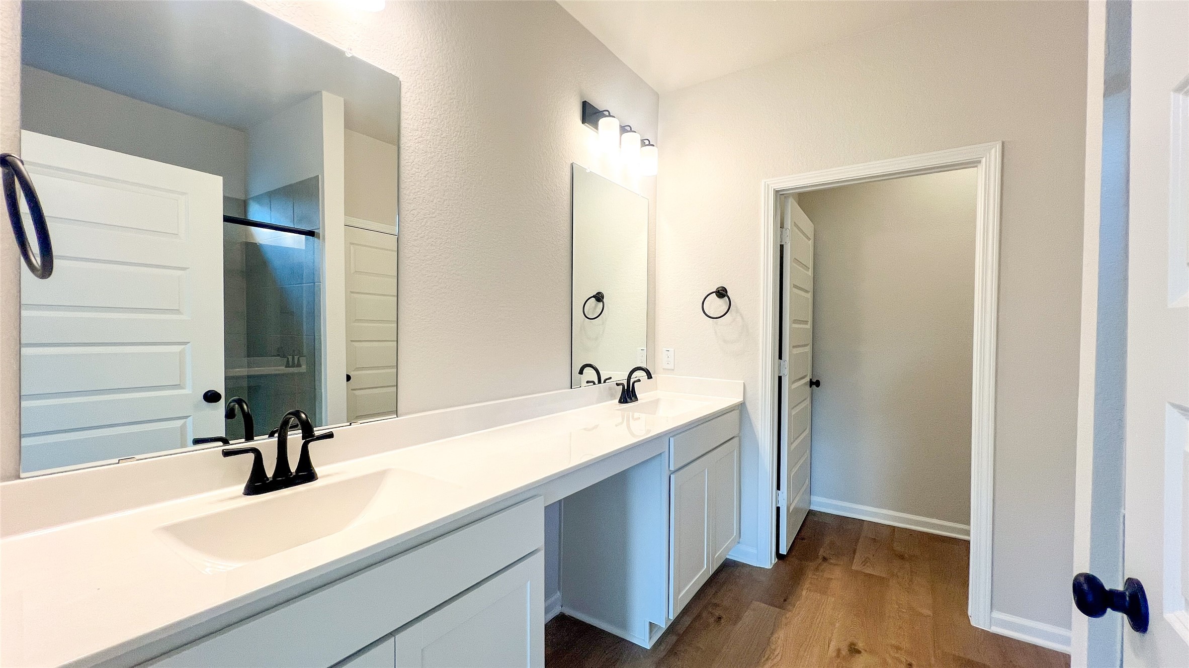 8126 Red Shiner Way Fulshear, TX 77441 - Photo 8 of 20 a bathroom with a sink and a mirror