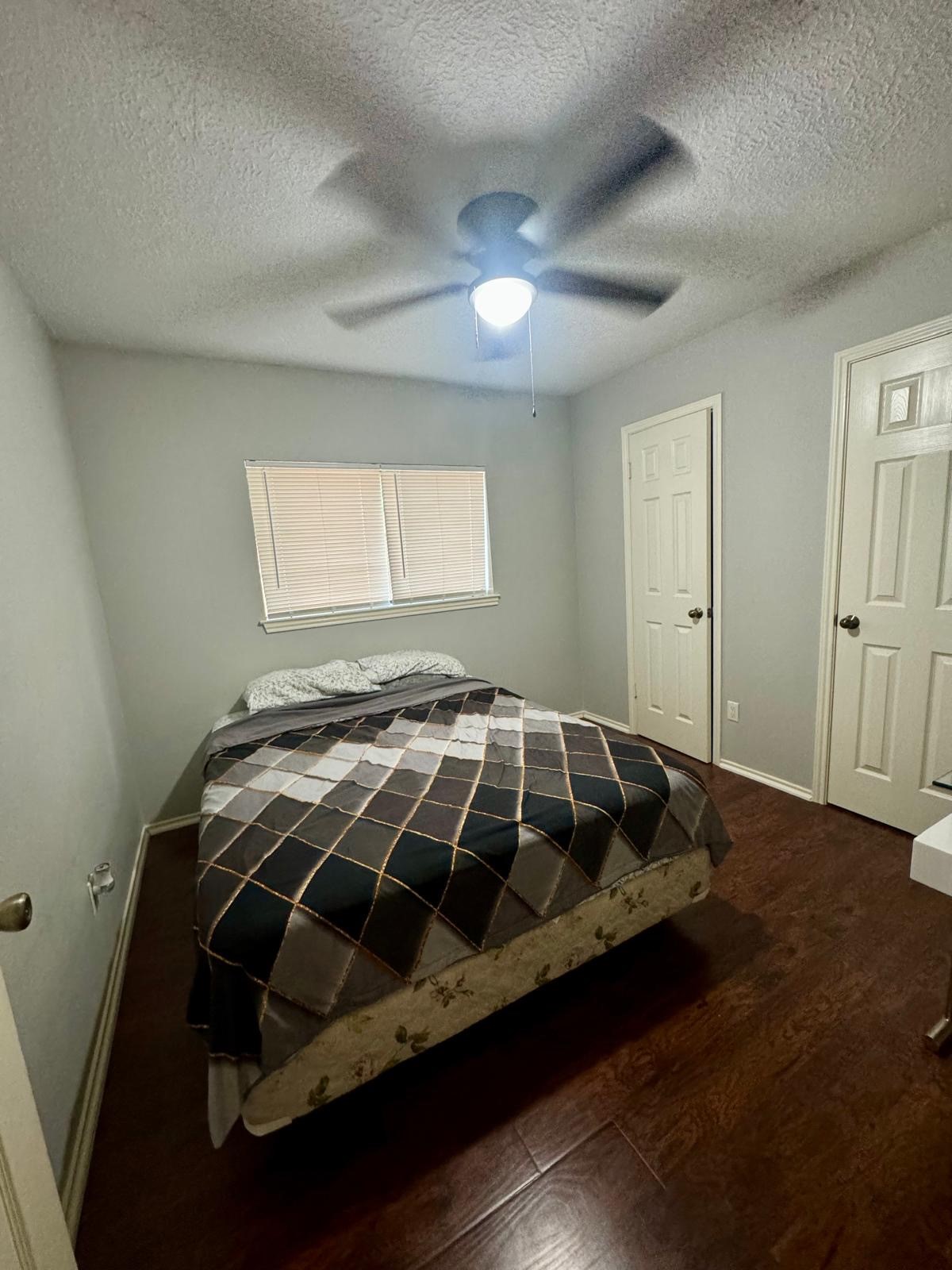 21418 Bassbrook Drive Spring, TX 77388 - Photo 11 of 29 a bed sitting in a bedroom next to a window
