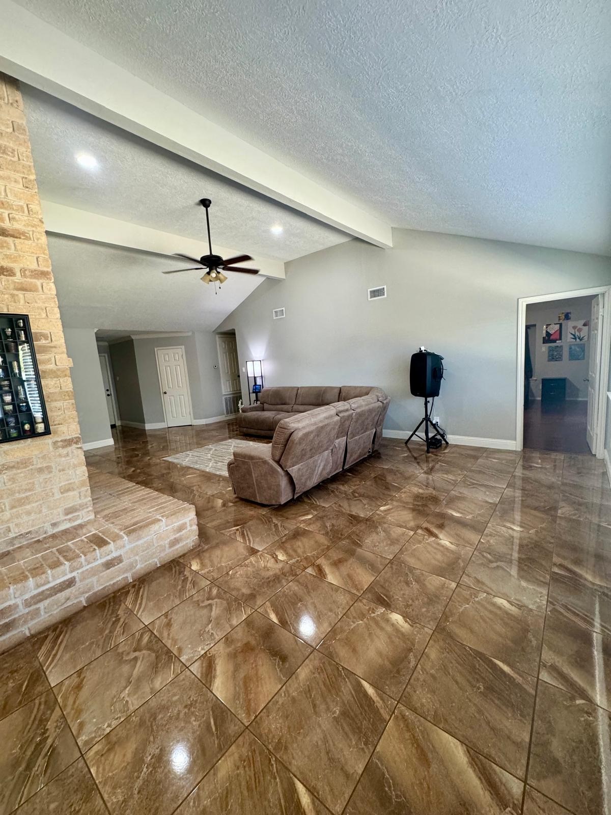 21418 Bassbrook Drive Spring, TX 77388 - Photo 17 of 29 a living room with furniture and a chandelier