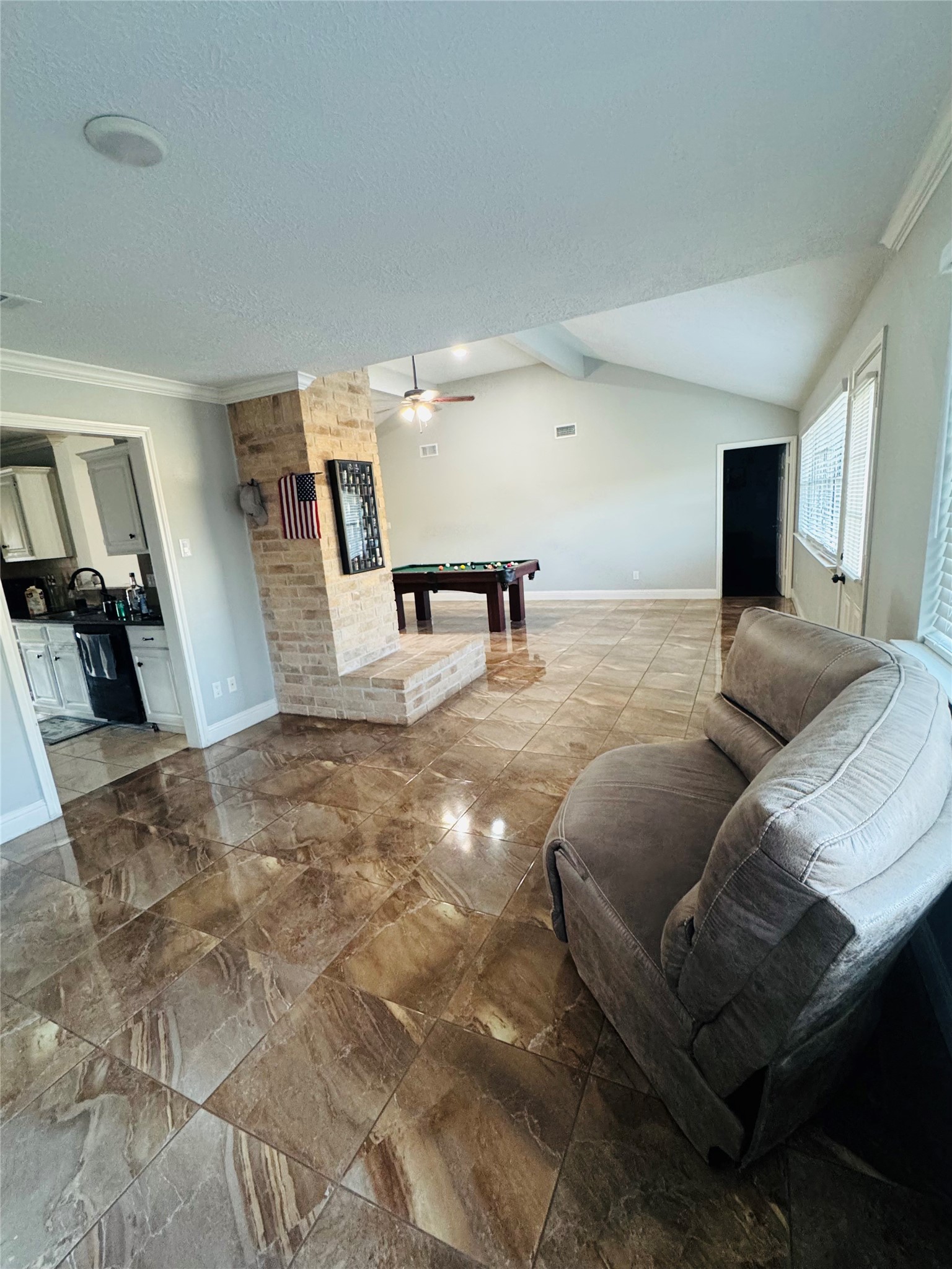 21418 Bassbrook Drive Spring, TX 77388 - Photo 19 of 29 a living room with furniture and a flat screen tv