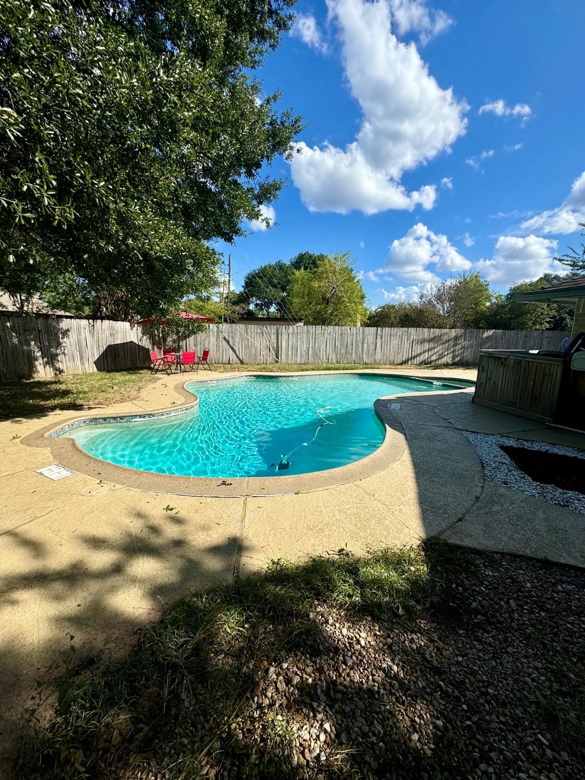 21418 Bassbrook Drive Spring, TX 77388 - Photo 2 of 29 a view of a swimming pool with a yard