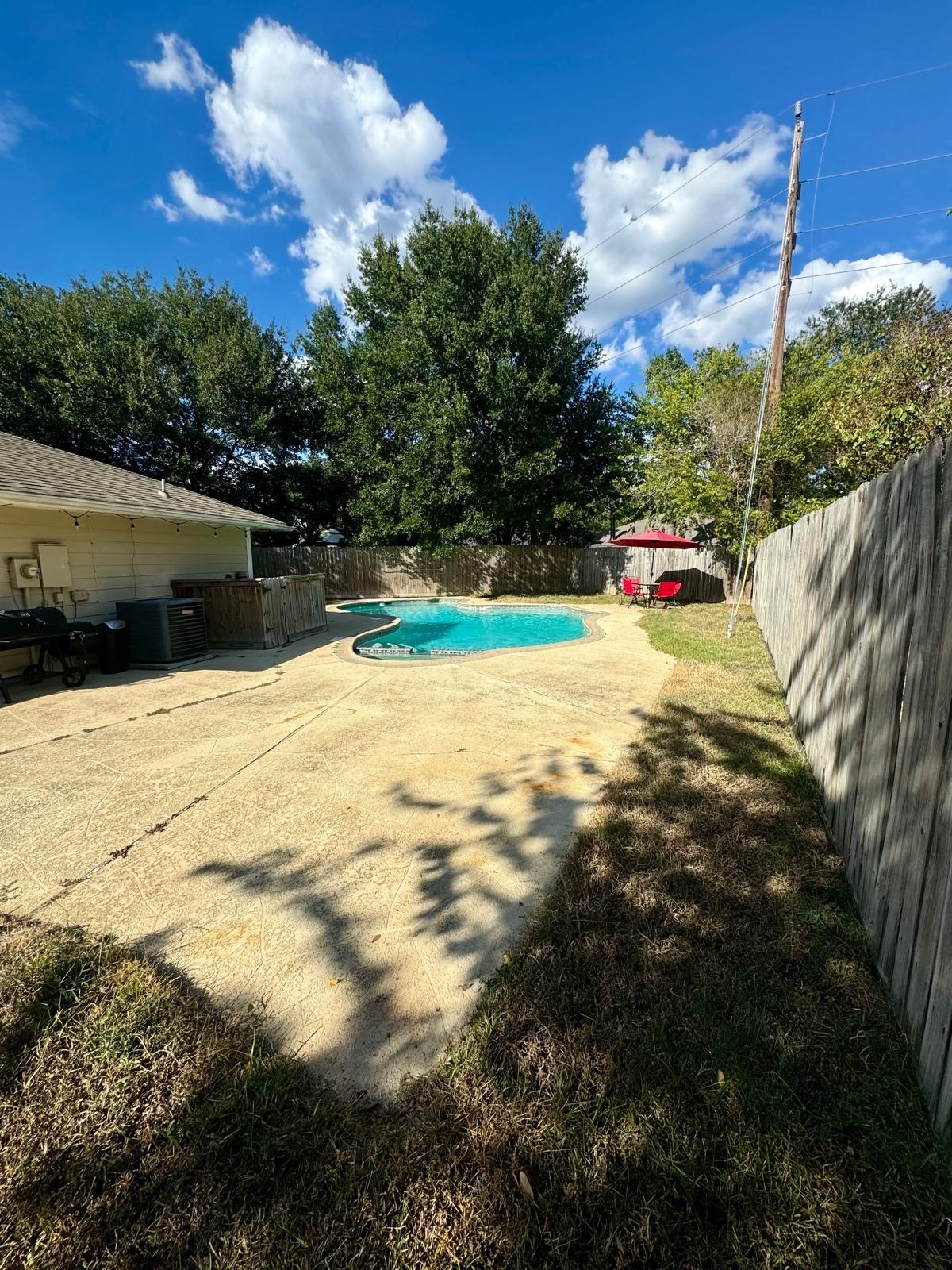 21418 Bassbrook Drive Spring, TX 77388 - Photo 27 of 29 a view of swimming pool with an outdoor space and seating area