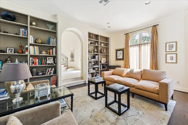 a living room with furniture fireplace and a flat screen tv