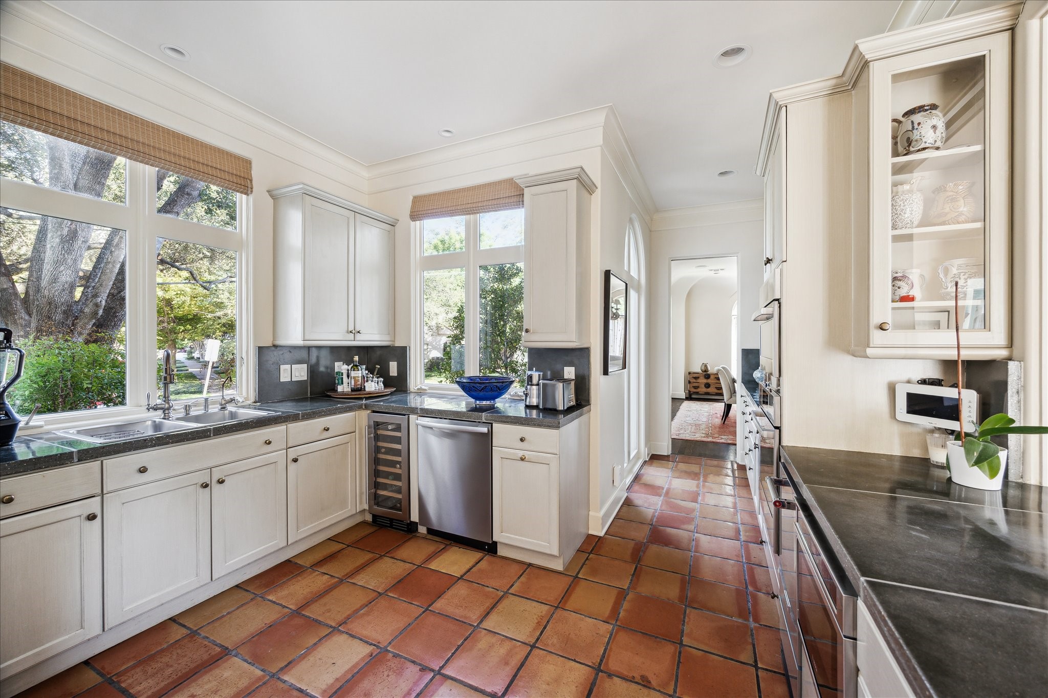 1804 Bolsover Street Houston, TX 77005 - Photo 18 of 46 a large white kitchen with stainless steel appliances granite countertop a sink and a large window