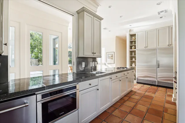 a view of a dining room with furniture and a large window