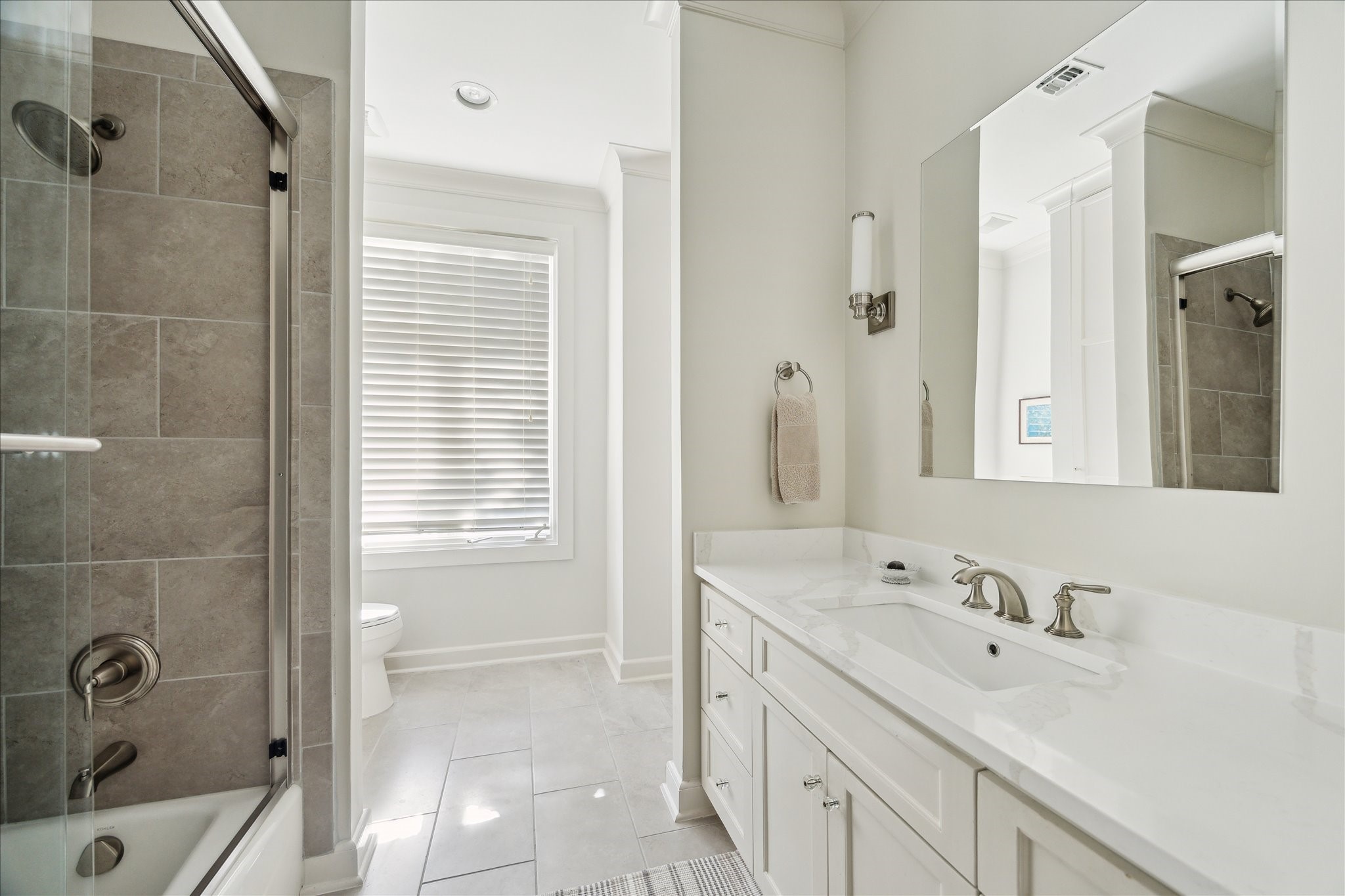 1804 Bolsover Street Houston, TX 77005 - Photo 32 of 46 a bathroom with a tub sink and mirror