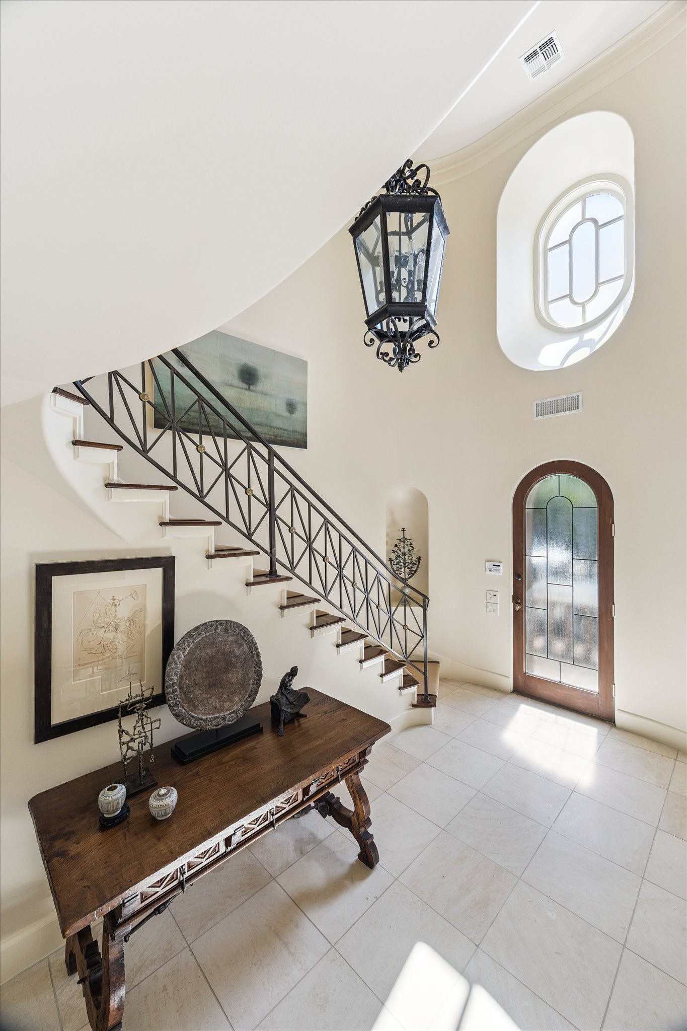 1804 Bolsover Street Houston, TX 77005 - Photo 6 of 46 Beautiful natural light with south facing door and architecturally interesting high window.