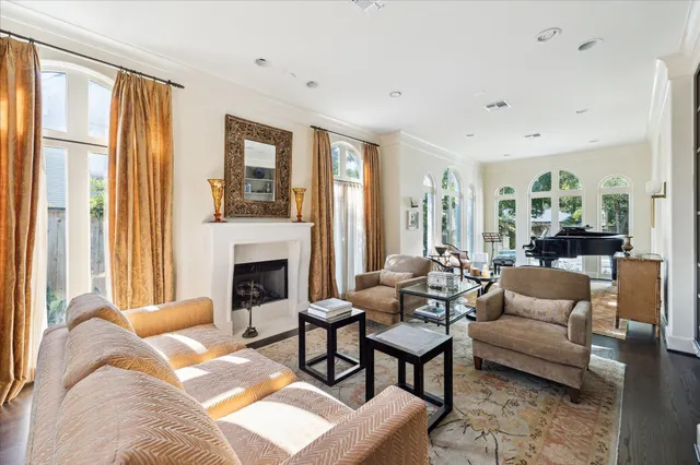 a view of a hallway with wooden floor and a dining room view