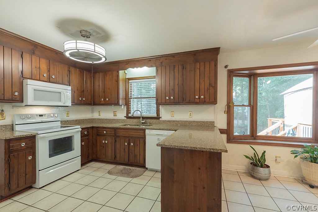 14007 Turtle Hill Road Midlothian, VA 23112 - Photo 14 of 40 a kitchen with a stove sink and cabinets