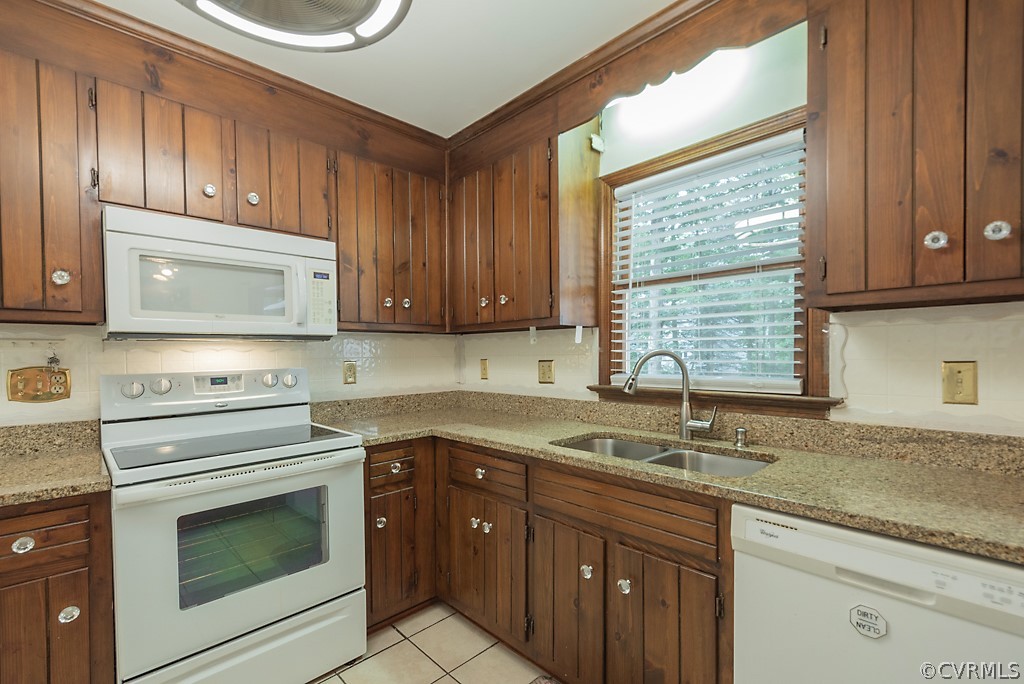 14007 Turtle Hill Road Midlothian, VA 23112 - Photo 16 of 40 a kitchen with a sink stove top oven and cabinets