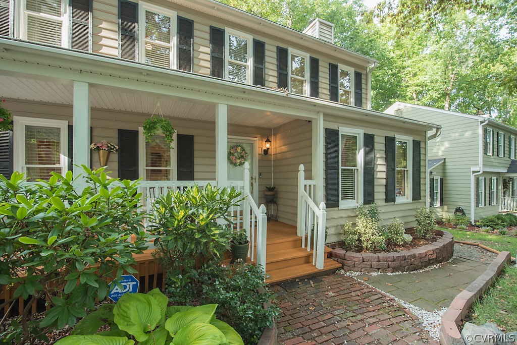 14007 Turtle Hill Road Midlothian, VA 23112 - Photo 2 of 40 front view of a brick house with potted plants