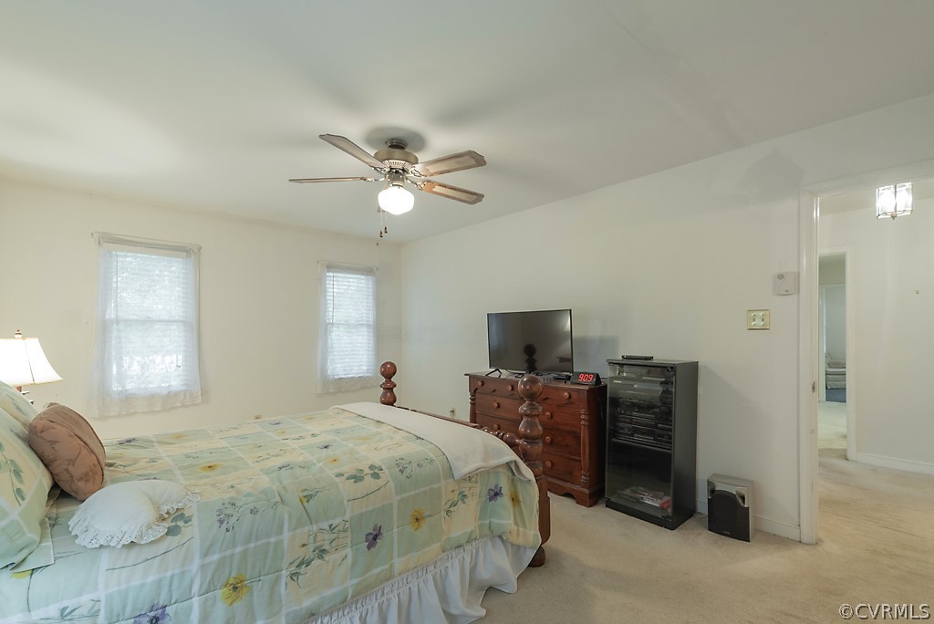 14007 Turtle Hill Road Midlothian, VA 23112 - Photo 21 of 40 a bedroom with a bed and a tv