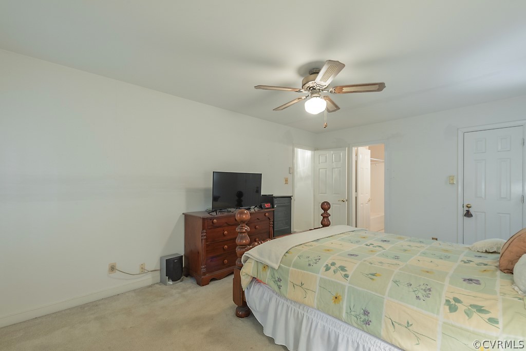 14007 Turtle Hill Road Midlothian, VA 23112 - Photo 22 of 40 a bedroom with a bed and a flat screen tv
