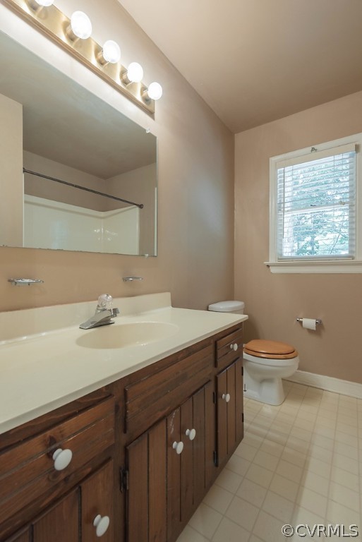 14007 Turtle Hill Road Midlothian, VA 23112 - Photo 32 of 40 a bathroom with a granite countertop sink a toilet and a mirror