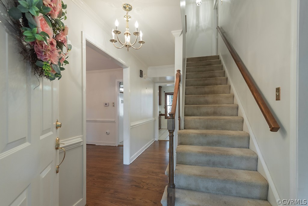 14007 Turtle Hill Road Midlothian, VA 23112 - Photo 5 of 40 a view of a hallway with wooden floor and staircase