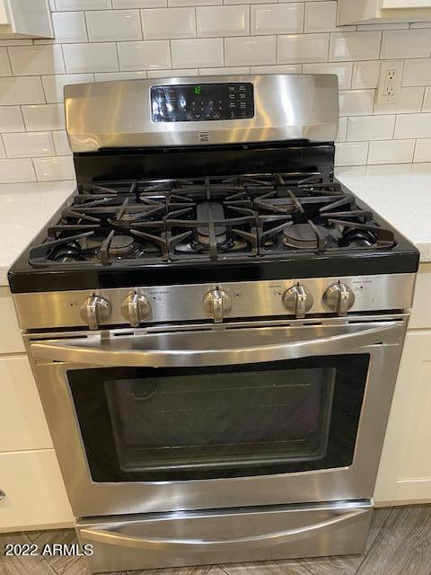 1416 East Del Rio Drive Tempe, AZ 85282 - Photo 8 of 27 a stove top oven sitting inside of a kitchen