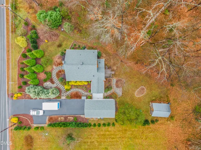 an aerial view of a house with swimming pool