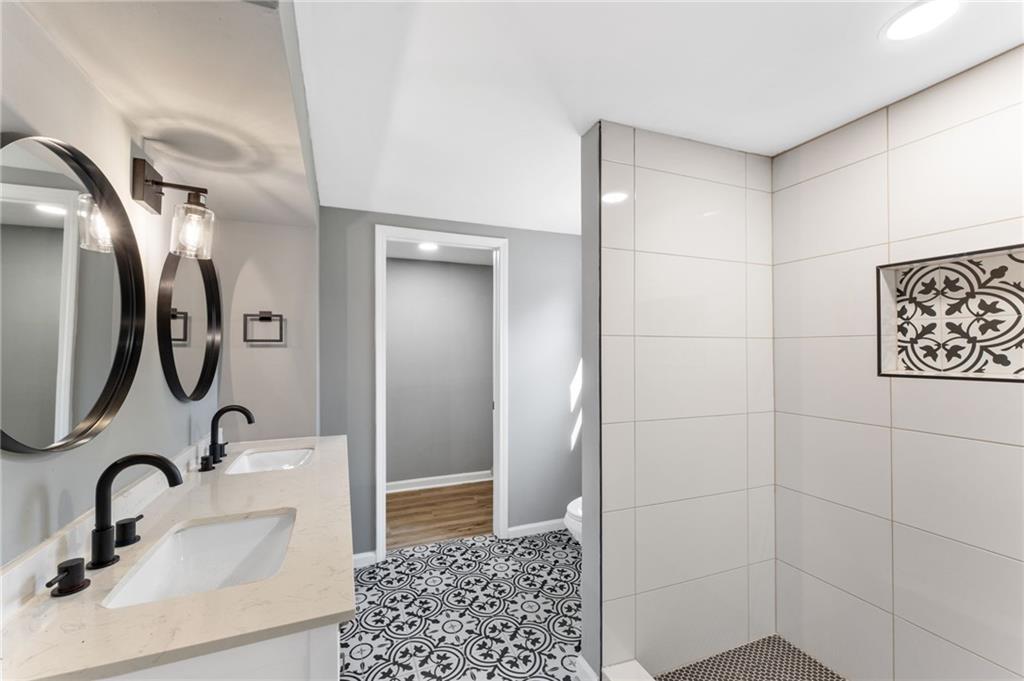 407 East 19th Street Rome, GA 30161 - Photo 11 of 17 a bathroom with a sink and a mirror