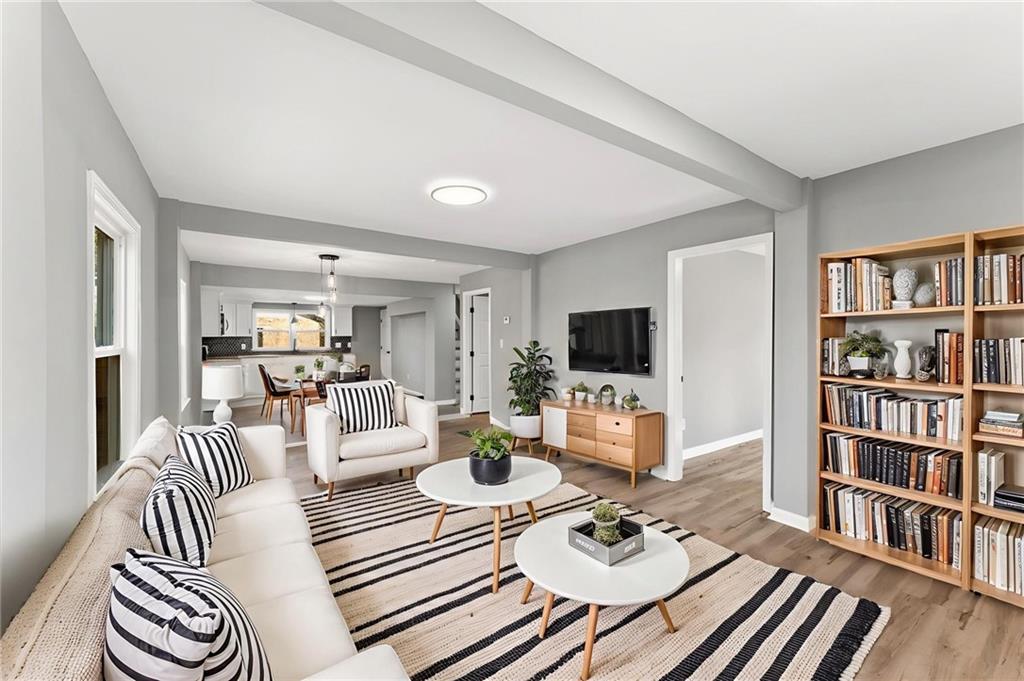 407 East 19th Street Rome, GA 30161 - Photo 2 of 17 a living room with furniture and a flat screen tv