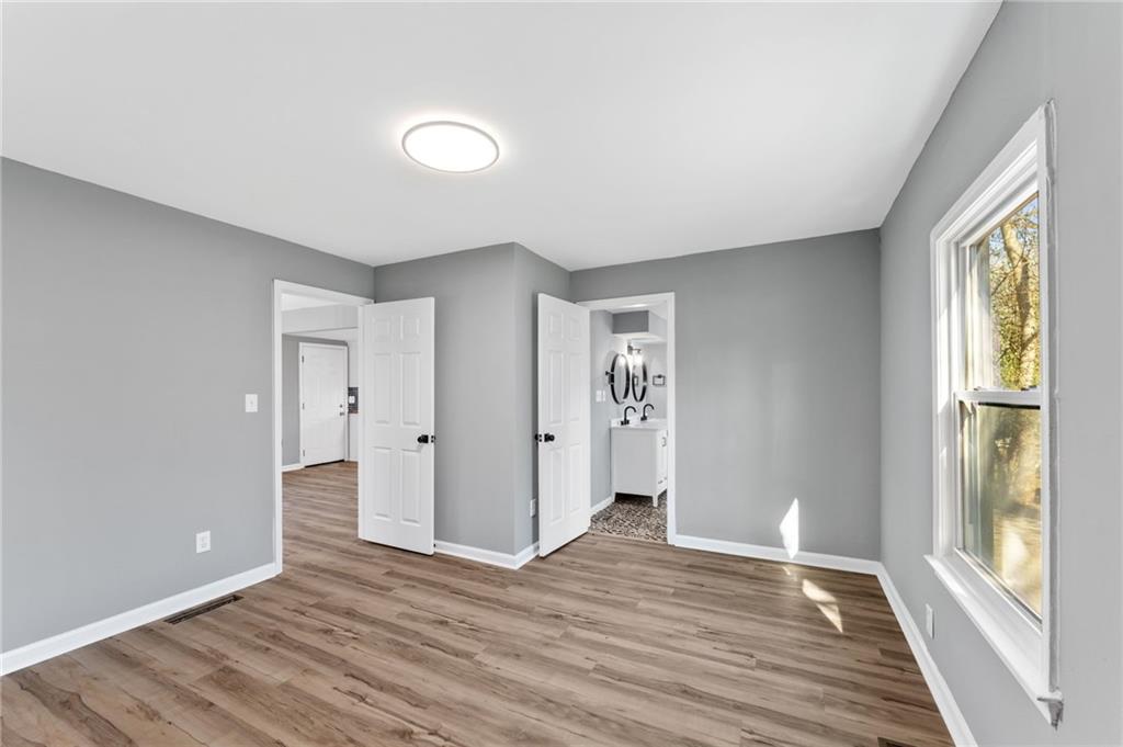 407 East 19th Street Rome, GA 30161 - Photo 9 of 17 a view of livingroom with hardwood floor and window
