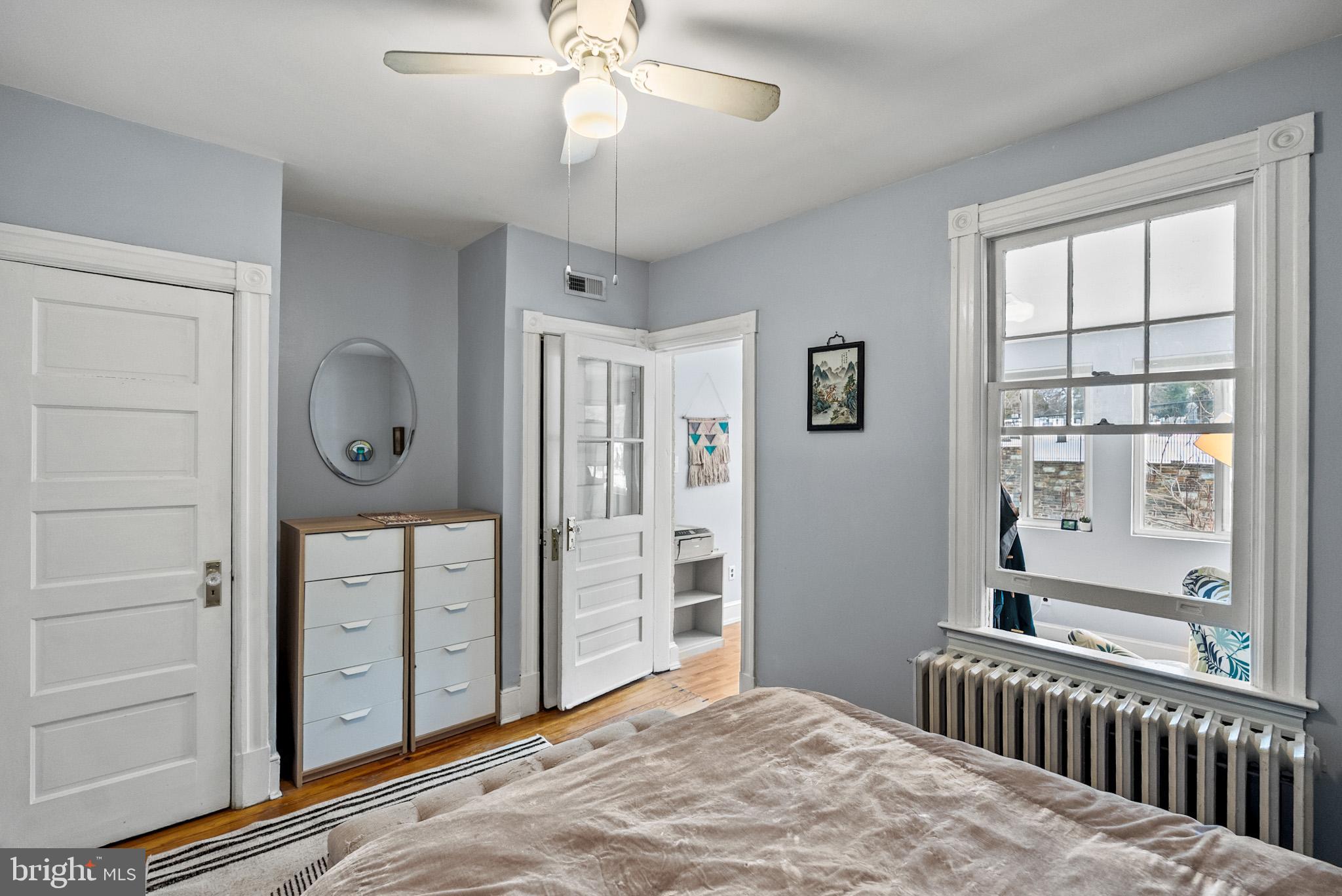 2422 2nd Street Northeast Washington, DC 20002 - Photo 18 of 40 a bedroom with a bed and a window