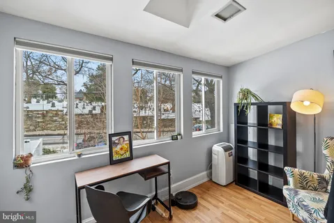a work room with furniture and windows