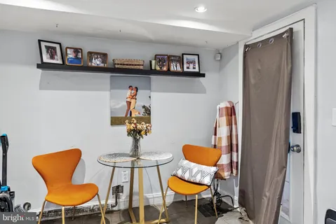 a view of a dining room with furniture and a rug