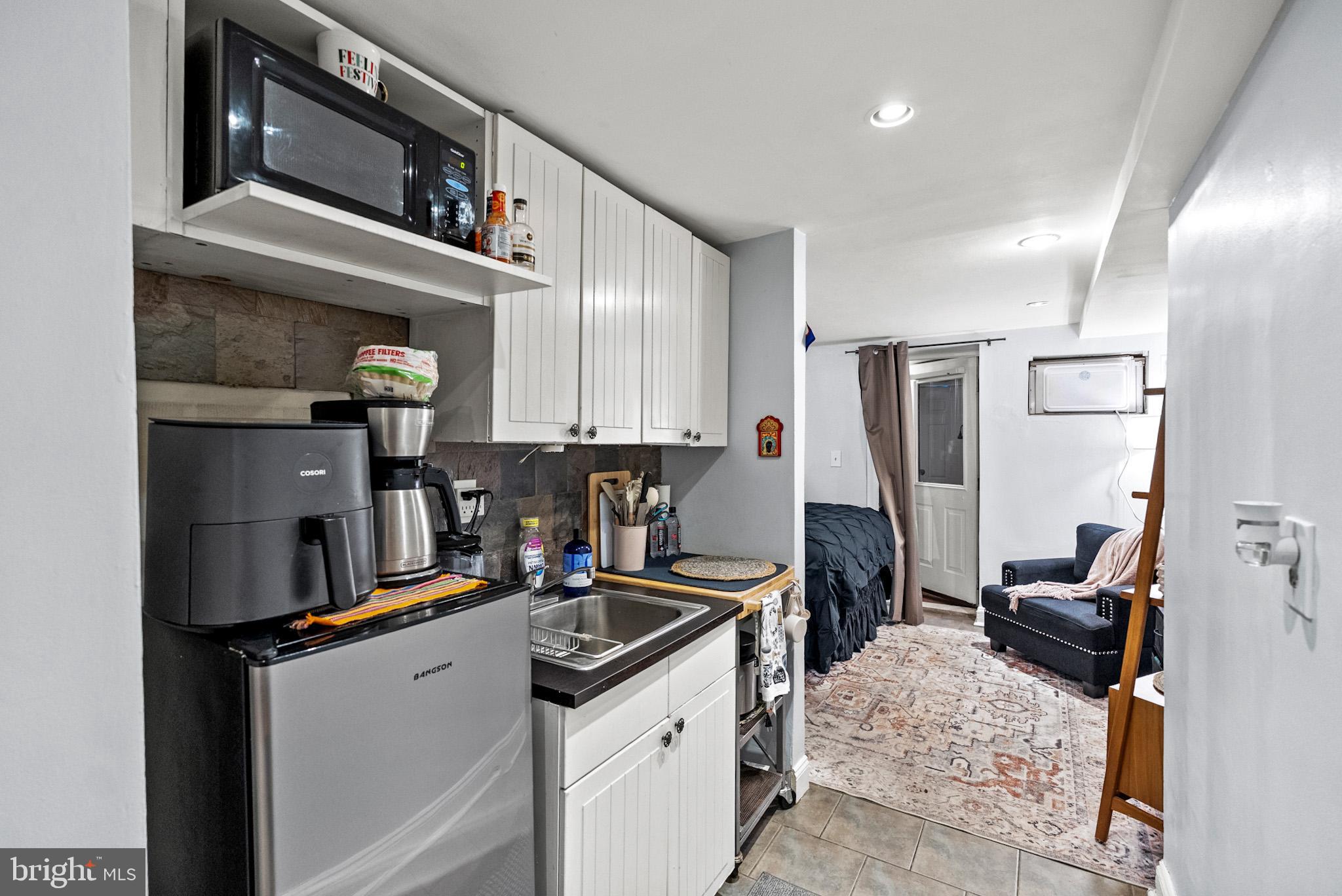 2422 2nd Street Northeast Washington, DC 20002 - Photo 29 of 40 a kitchen with a sink appliances and cabinets