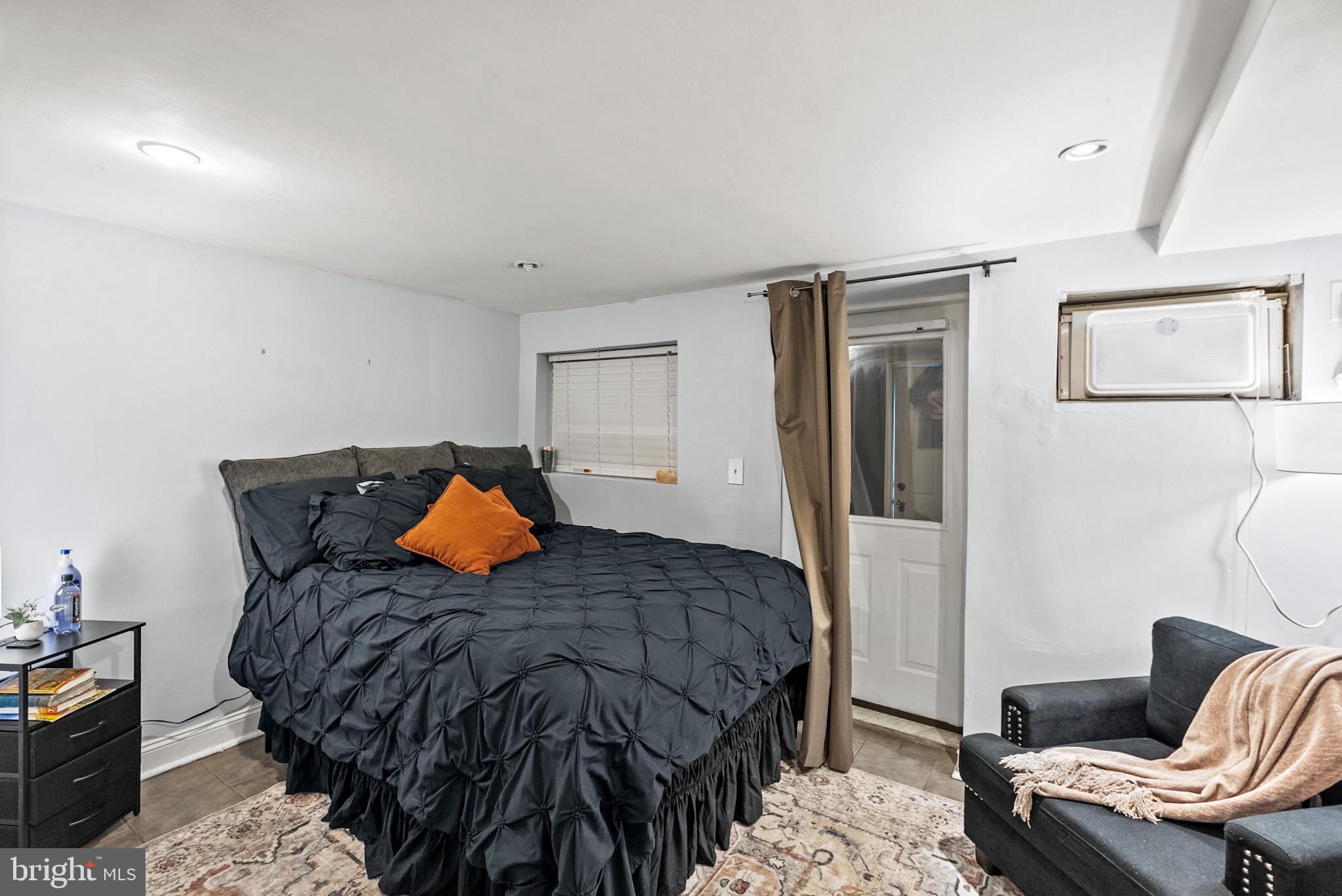 2422 2nd Street Northeast Washington, DC 20002 - Photo 30 of 40 a bedroom with a bed and chair