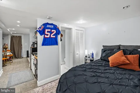 a bedroom with a bed and a closet