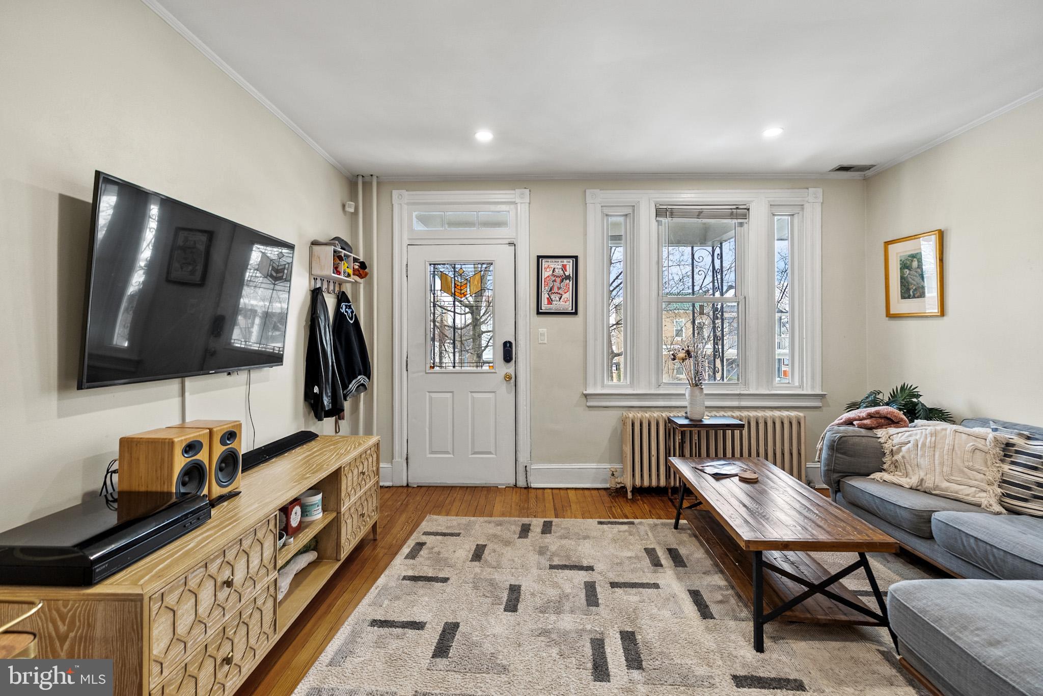 2422 2nd Street Northeast Washington, DC 20002 - Photo 4 of 40 a living room with furniture and a flat screen tv