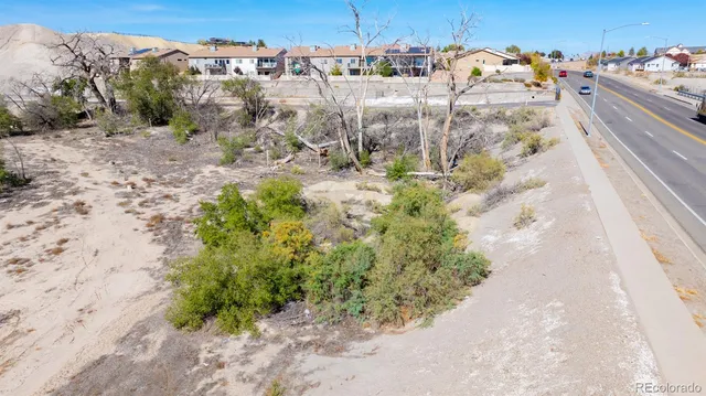 a view of a town with big trees