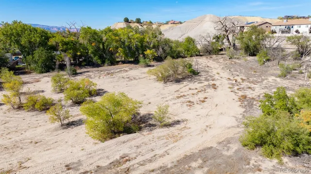 a view of a street with a yard