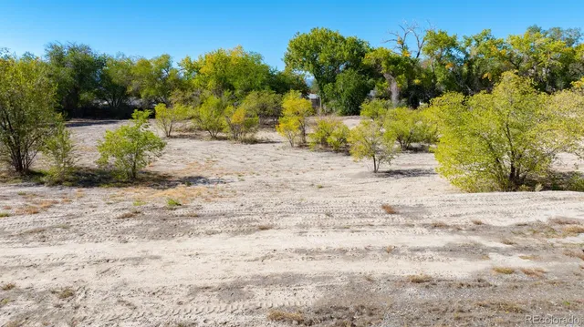 a view of a beach with a building in the background