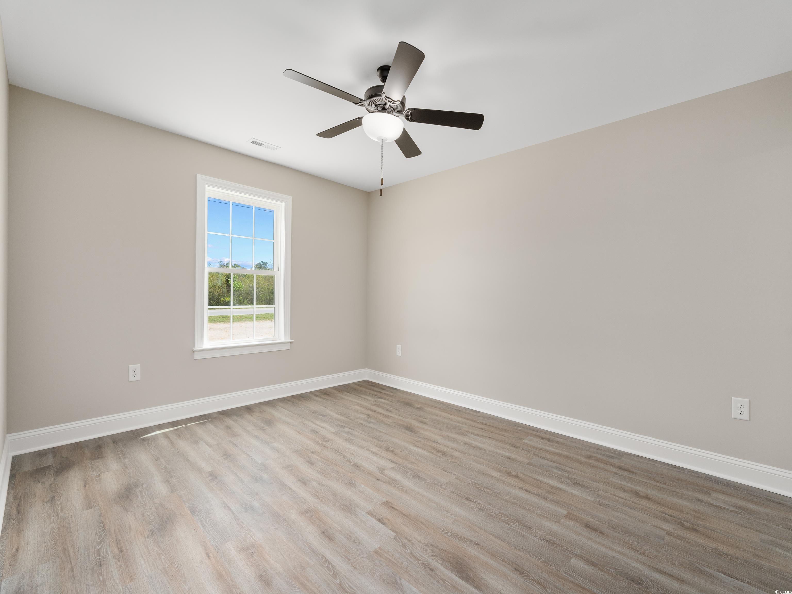 3433 B And S Road Loris, SC 29569 - Photo 15 of 27 Spare room with ceiling fan, visible vents, basebo