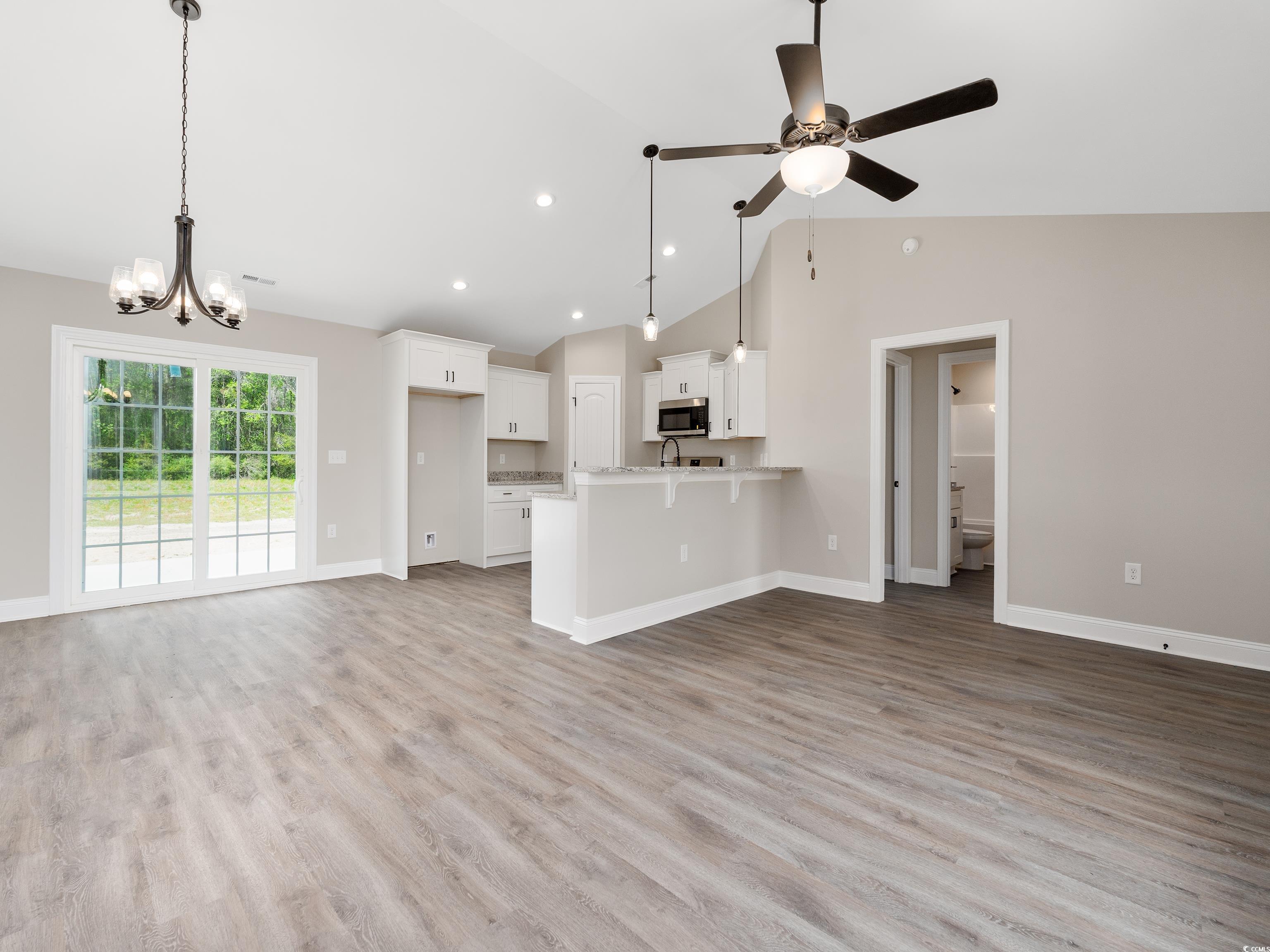 3433 B And S Road Loris, SC 29569 - Photo 8 of 27 Unfurnished living room featuring ceiling fan with