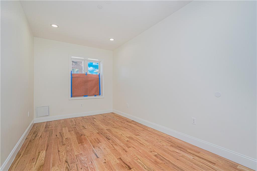 160 Bay 29th Street Brooklyn, NY 11214 - Photo 12 of 27 a view of empty room with wooden floor