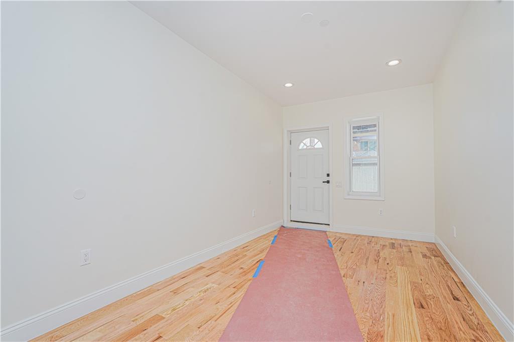 160 Bay 29th Street Brooklyn, NY 11214 - Photo 13 of 27 a view of hallway with wooden floor