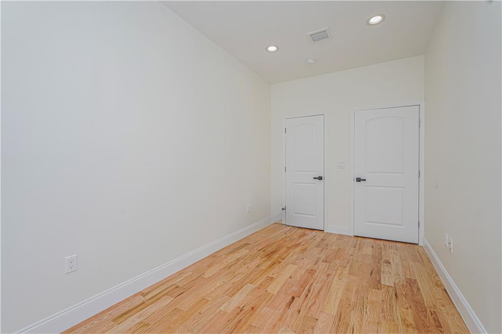 160 Bay 29th Street Brooklyn, NY 11214 - Photo 16 of 27 a view of empty room with wooden floor
